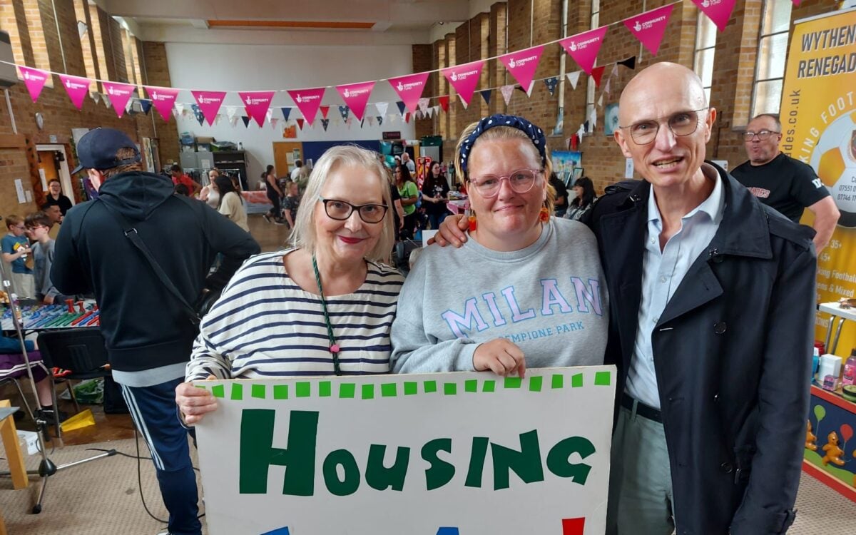 Cllrs Astrid Johnson and Rob Nunney with Green candidate Zoe Marlow. They are smiling at the camera and holding a banner which reads 'Housing for all!'